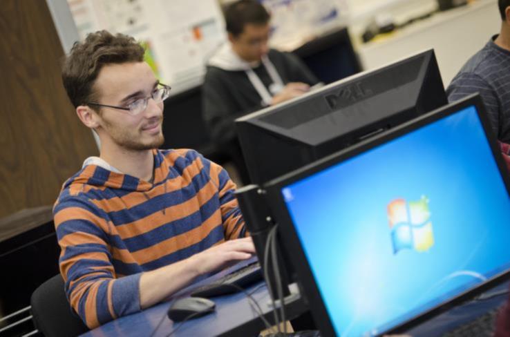 A student using a computer in a classroom.